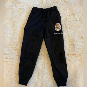 Lot: Real Madrid and FC Barcelona youth joggers, size small and medium